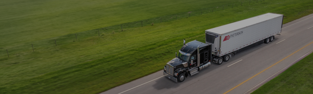 A Patterson truck on a highway, on its way to ship freight